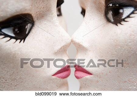 Stock Photo - Female mannequin heads kissing. Fotosearch