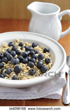 Fresh blueberries in bowl of cereal View Large Photo Image Stock Photo - Fresh blueberries in bowl of cereal. Fotosearch