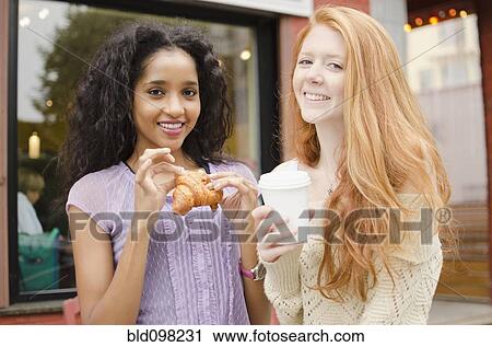 Friends having breakfast outdoors View Large Photo Image Stock Image - Friends having breakfast outdoors. Fotosearch