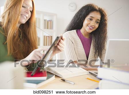 Friends studying together View Large Photo Image Stock Image - Friends studying together. Fotosearch