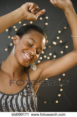 Stock Image - Glamorous Black woman dancing. Fotosearch