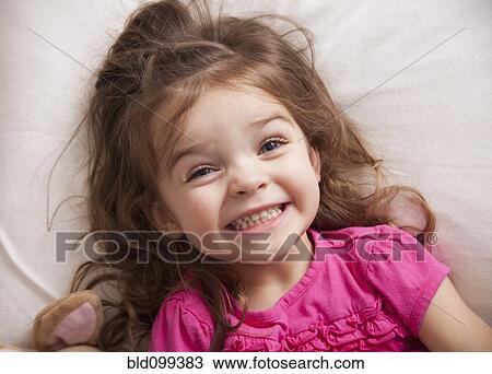 Stock Image - Grinning Caucasian girl. Fotosearch