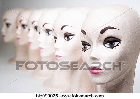 Stock Photography - Group of bald, female mannequin heads. Fotosearch