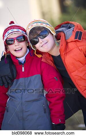Stock Photo - Hispanic boys in cold weather clothing. Fotosearch