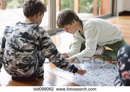 Hispanic boys playing board game View Large Photo Image Stock Image - Hispanic boys playing board game. Fotosearch
