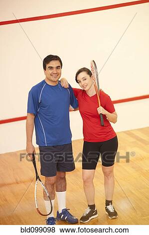 Hispanic couple playing racquetball View Large Photo Image Stock Photo - Hispanic couple playing racquetball. Fotosearch