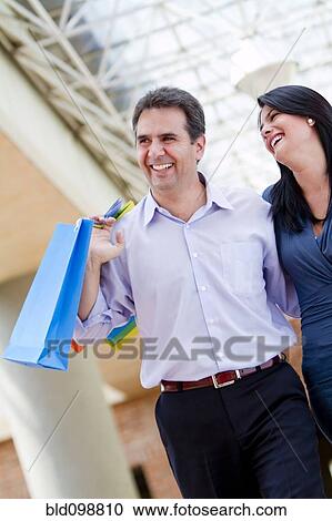 Stock Image - Hispanic couple shopping together. Fotosearch