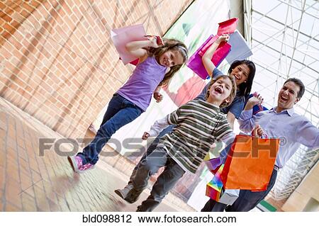 Hispanic family shopping together View Large Photo Image Stock Image - Hispanic family shopping together. Fotosearch