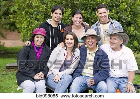 Hispanic family sitting together View Large Photo Image Stock Photography - Hispanic family sitting together. Fotosearch