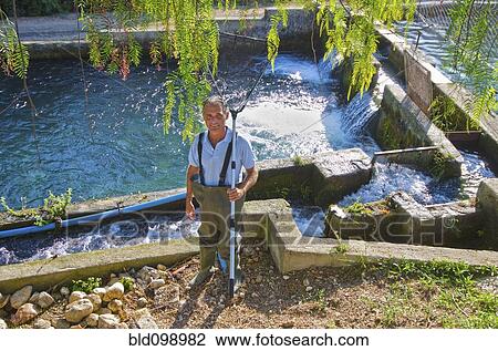Hispanic fisherman holding net View Large Photo Image Stock Image - Hispanic fisherman holding net. Fotosearch