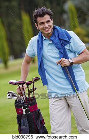 Hispanic man playing golf View Large Photo Image Stock Photograph - Hispanic man playing golf. Fotosearch