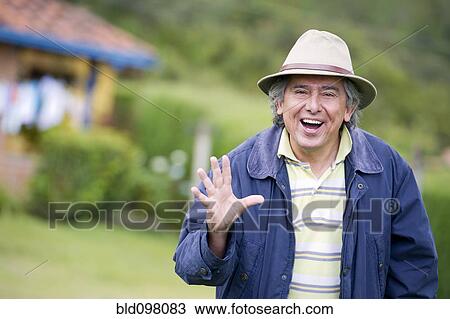 Stock Image - Hispanic man waving. Fotosearch