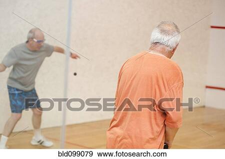 Hispanic men playing racquetball View Large Photo Image Stock Photo - Hispanic men playing racquetball. Fotosearch