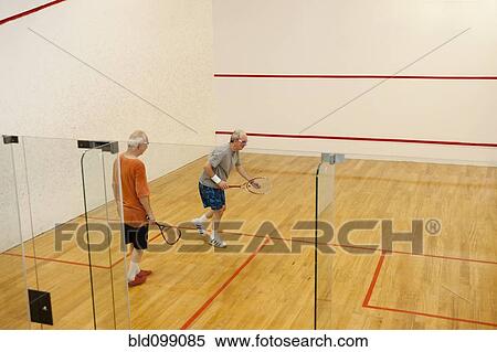 Hispanic men playing racquetball View Large Photo Image Stock Photography - Hispanic men playing racquetball. Fotosearch
