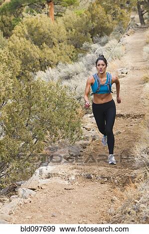 Hispanic runner training in remote area View Large Photo Image Stock Photo - Hispanic runner training in remote area. Fotosearch