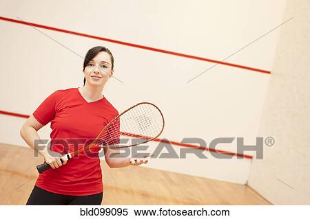 Stock Photography - Hispanic woman playing racquetball. Fotosearch