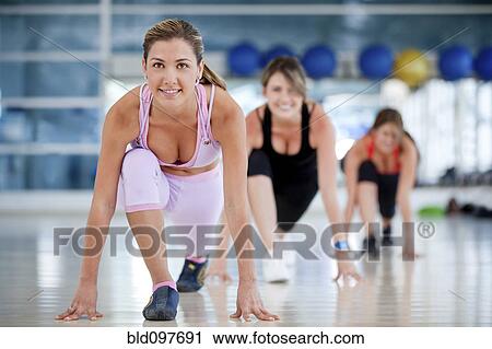 Hispanic women exercising in health club View Large Photo Image Stock Image - Hispanic women exercising in health club. Fotosearch