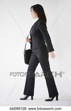 Stock Photo - Japanese businesswoman carrying briefcase. Fotosearch