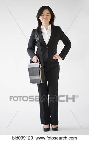 Japanese businesswoman carrying briefcase View Large Photo Image Stock Photo - Japanese businesswoman carrying briefcase. Fotosearch