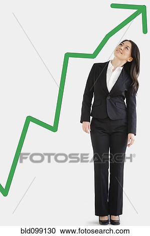 Japanese businesswoman looking at green arrow View Large Photo Image Stock Image - Japanese businesswoman looking at green arrow. Fotosearch