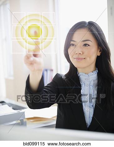 Japanese businesswoman touching digital screen View Large Photo Image Stock Photography - Japanese businesswoman touching digital screen. Fotosearch