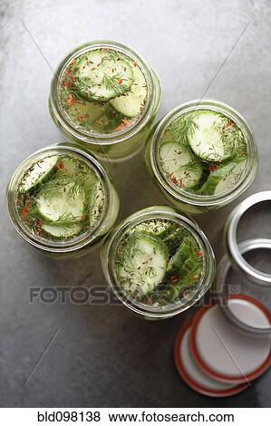 Stock Photo - Jars of pickled cucumbers. Fotosearch