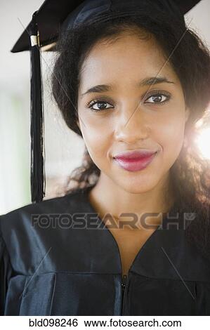 Middle Eastern woman in graduation cap and gown View Large Photo Image Stock Photograph - Middle Eastern woman in graduation cap and gown. Fotosearch