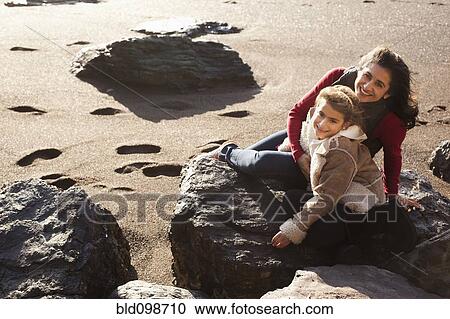 Stock Image - Mother and daughter enjoying the beach. Fotosearch