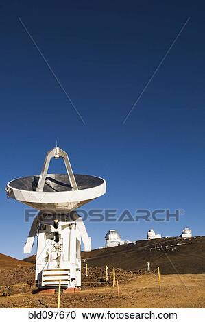 Stock Image - Observatory and satellite dish on hillside. Fotosearch
