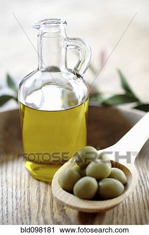 Olives and olive oil in jug View Large Photo Image Stock Image - Olives and olive oil in jug. Fotosearch