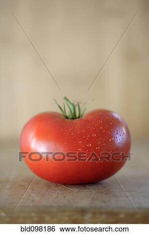 Stock Photograph - One red tomato. Fotosearch
