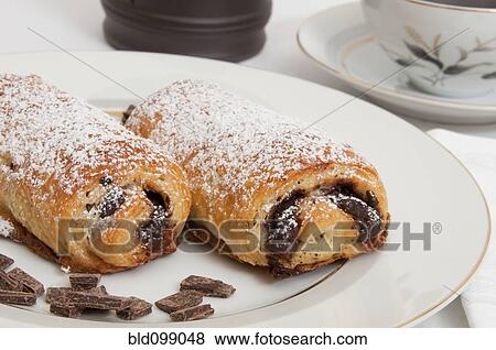 Powdered sugar on chocolate croissants View Large Photo Image Stock Photo - Powdered sugar on chocolate croissants. Fotosearch