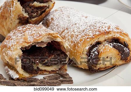 Powdered sugar on chocolate croissants View Large Photo Image Stock Photo - Powdered sugar on chocolate croissants. Fotosearch