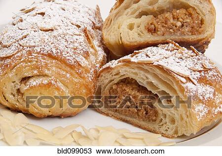 Stock Image - Powdered sugar on croissants. Fotosearch