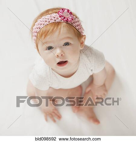 Stock Image - Serious Caucasian baby girl. Fotosearch