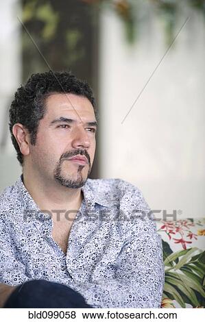Stock Photo - Serious Hispanic man with goatee. Fotosearch