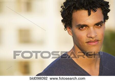 Stock Image - Serious mixed race man. Fotosearch