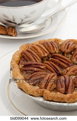 Picture - Small pecan pie and cup of coffee. Fotosearch
