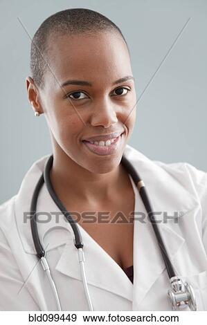 Stock Photo - Smiling Black doctor. Fotosearch