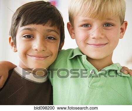 Smiling boys hugging View Large Photo Image Stock Image - Smiling boys hugging. Fotosearch