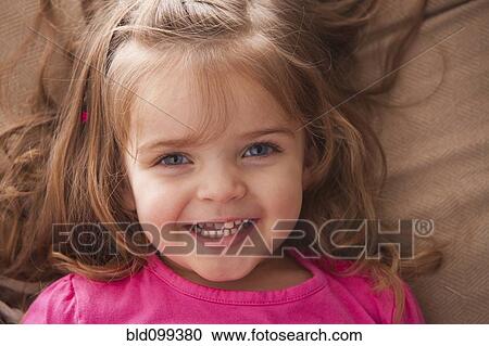 Stock Image - Smiling Caucasian girl. Fotosearch