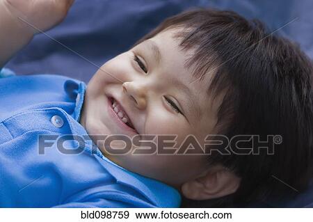 Stock Photo - Smiling Hispanic baby boy. Fotosearch