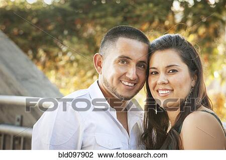 Stock Image - Smiling Hispanic couple. Fotosearch