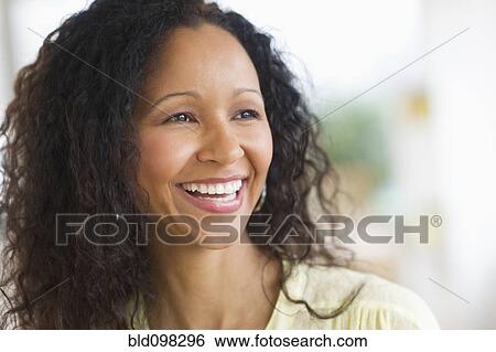 Stock Photograph - Smiling Hispanic woman. Fotosearch