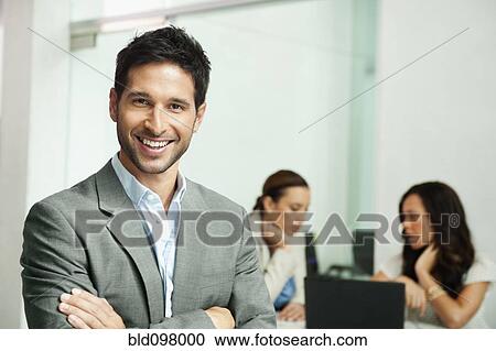 Stock Image - Smiling mixed race businessman. Fotosearch