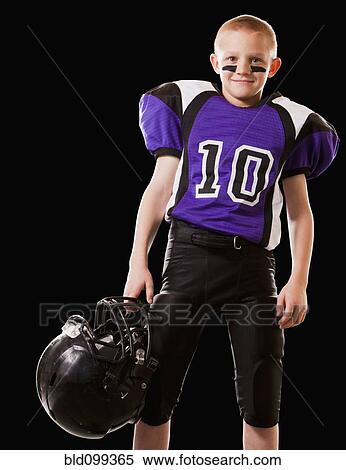 Stock Photography - Smiling mixed race football player. Fotosearch
