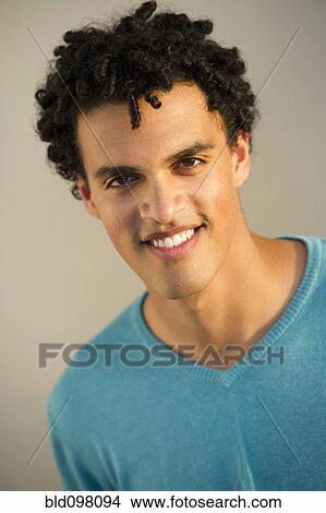Picture - Smiling mixed race man. Fotosearch