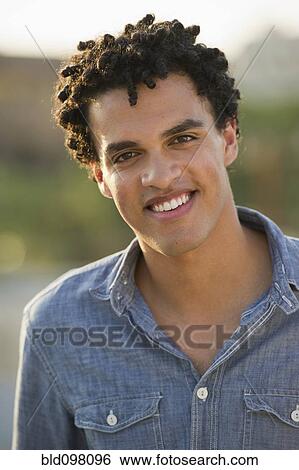 Smiling mixed race man View Large Photo Image Stock Photograph - Smiling mixed race man. Fotosearch