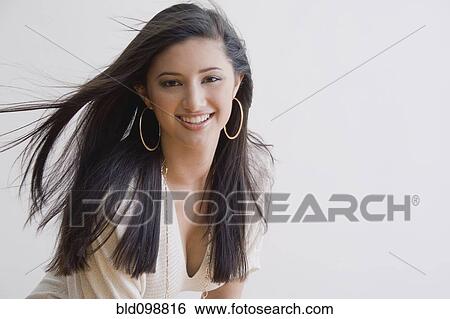 Stock Photograph - Smiling mixed race woman. Fotosearch