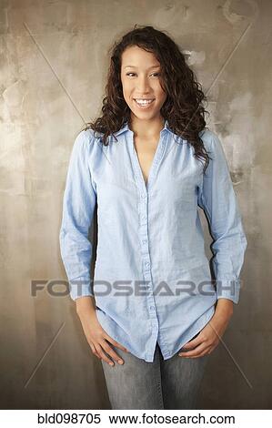 Smiling woman standing View Large Photo Image Stock Photography - Smiling woman standing. Fotosearch